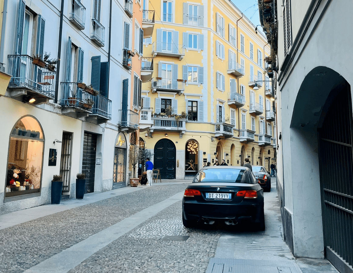 A narrow, cobblestone street in Brera, Milan