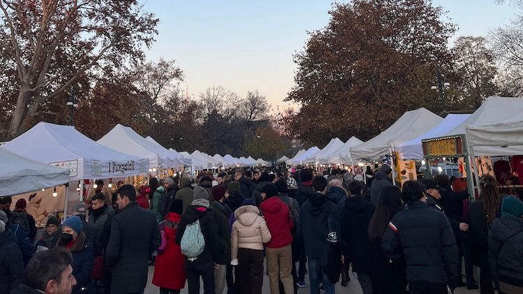 A crowded Christmas market in Parco Sempione, Milan.