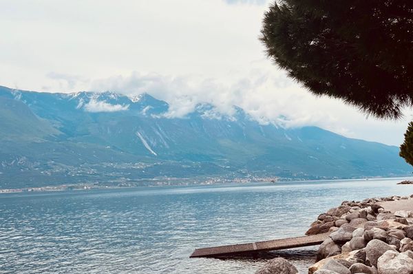 A foggy day on the rocky coast of Lake Garda, Italy