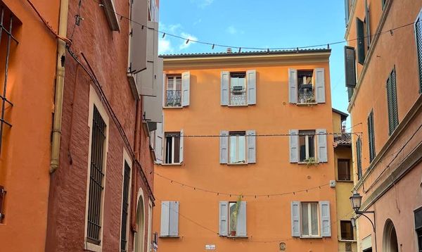 A empty cobblestone street in Bologna, Italy.