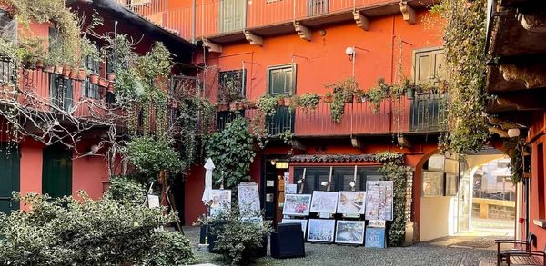 A red Milanese ringhiera along the Naviglio Grande canal.